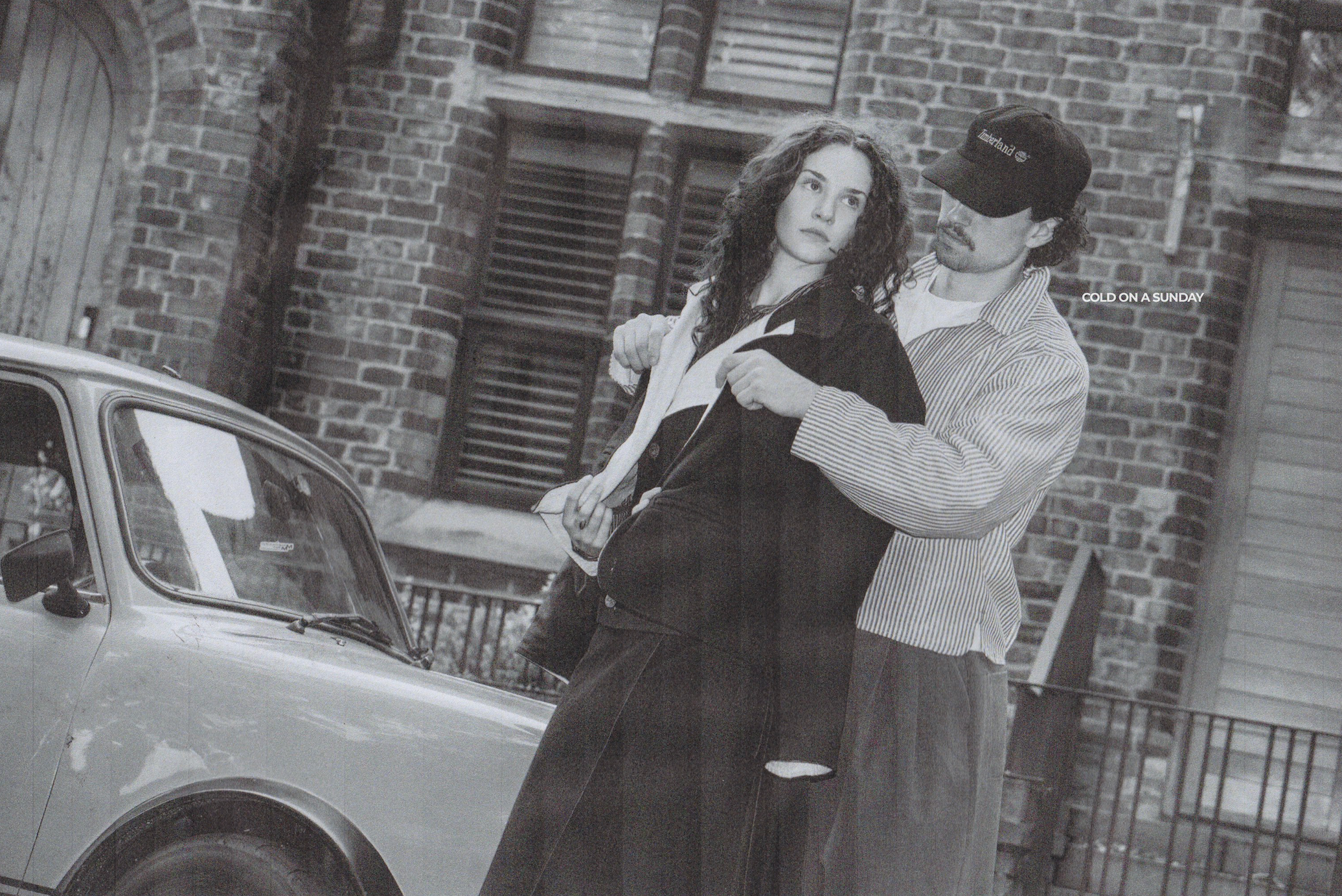 Maddie in the Felix Vest beside the pinstripe Shep Jacket, leaning together by a car in Manchester