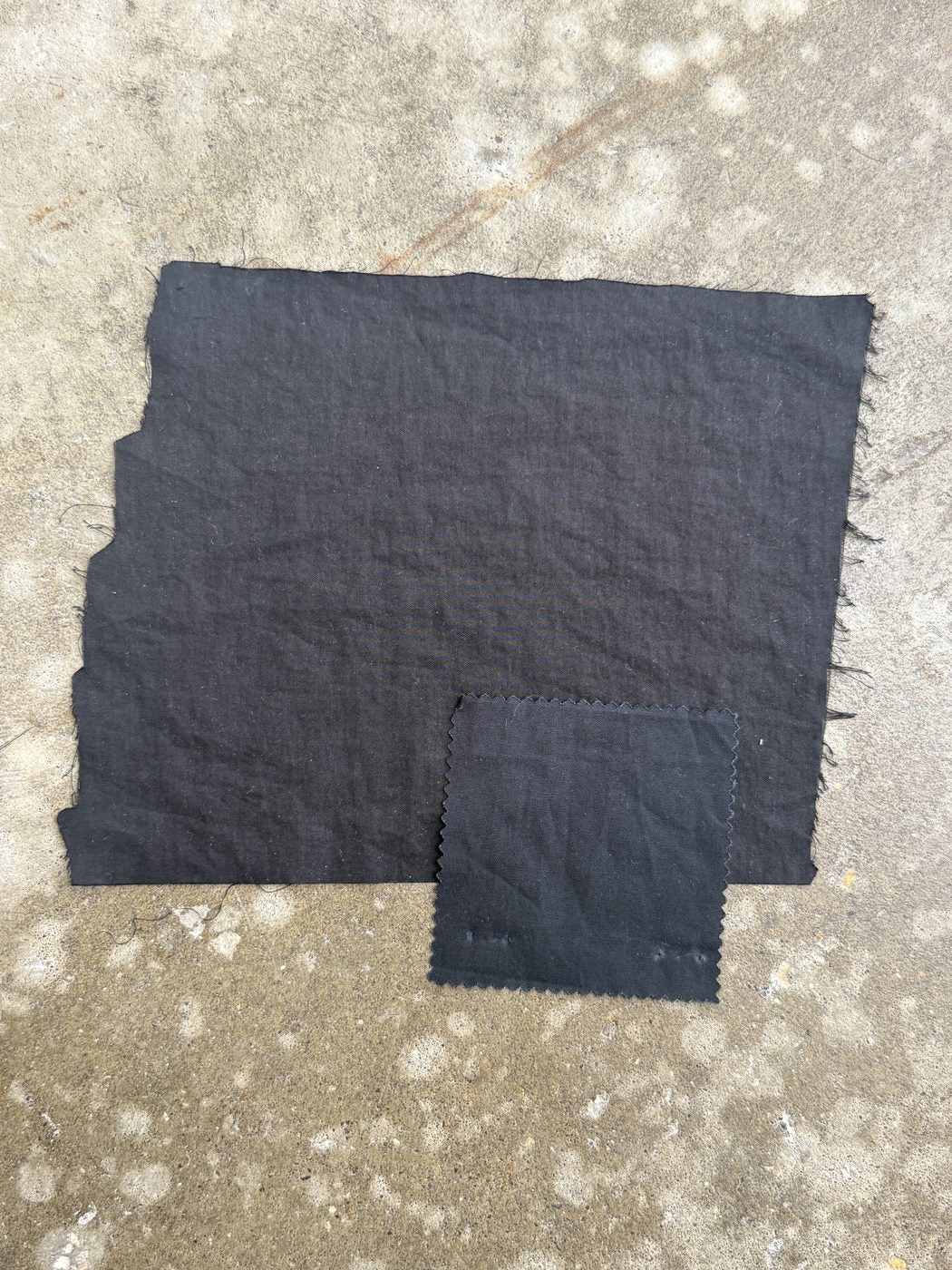 Subtle checked outer fabric with a dark lining swatch